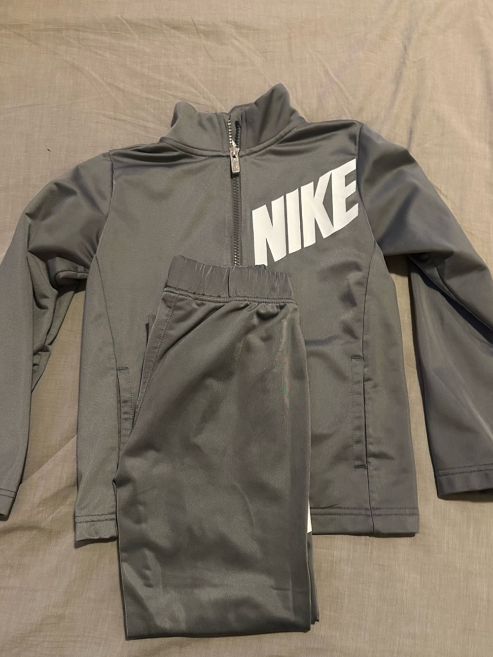 Nike Gray Jacket with White Tag and Black Logo